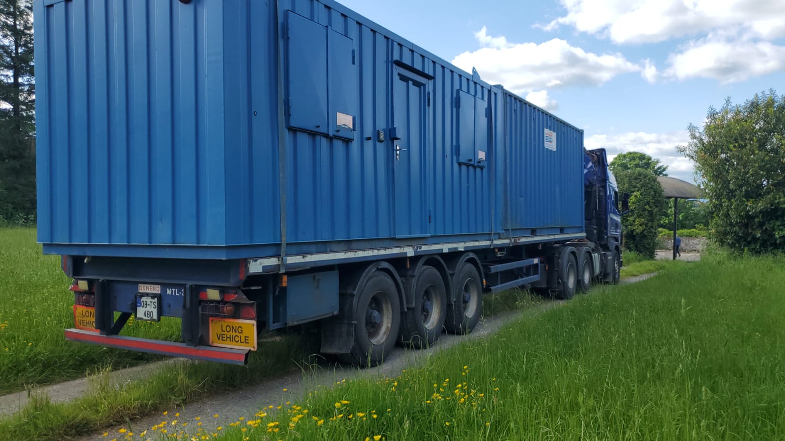truck delivering a container